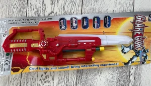 Игрушка Бластер свет, звук  на планшете 53х18 см